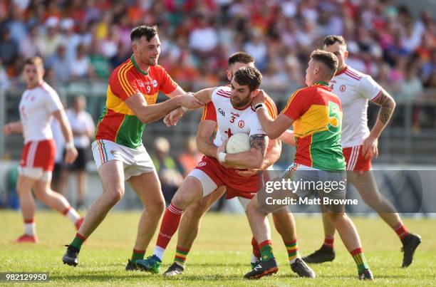 Carlow , Ireland - 23 June 2018; Ronan McNamee of Tyrone in action against Eoghan Ruth, Shane Redmond and Jordan Morrissey of Carlow during the GAA...