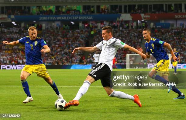 Julian Draxler of Germany competes with Sebastian Larsson of Sweden during the 2018 FIFA World Cup Russia group F match between Germany and Sweden at...