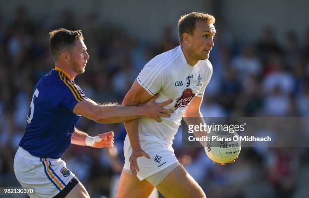 Longford , Ireland - 23 June 2018; Tommy Moolick of Kildare in action against Michael Quinn of Longford during the GAA Football All-Ireland Senior...