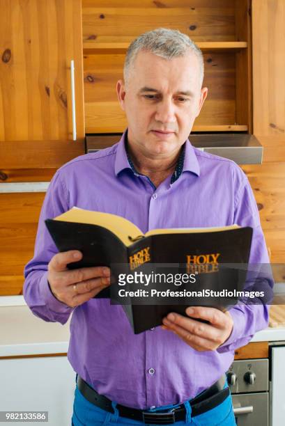 man reading the words of god - pastor stock pictures, royalty-free photos & images