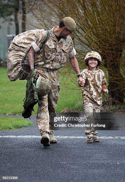 Proud five-year-old Ashton Peterson walks home with his father Sergeant Carl Peterson, of 2nd Battalion The Yorkshire Regiment , on his return from...