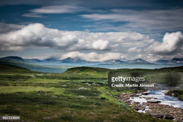 cloudy sky above land, jamtland, sweden - jamtland stock pictures, royalty-free photos & images