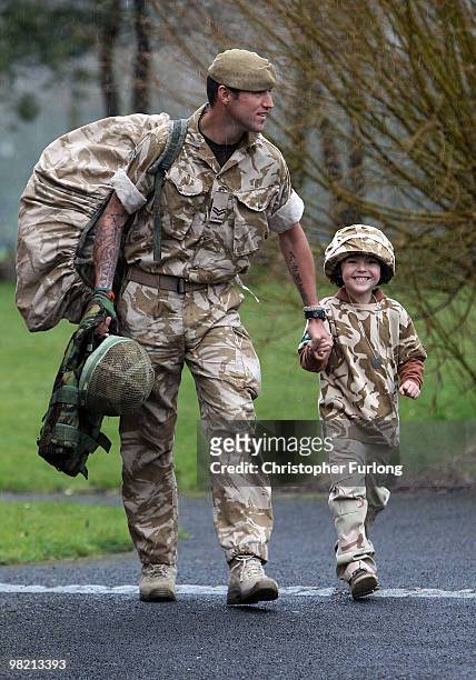 Proud five-year-old Ashton Peterson walks home with his father Sergeant Carl Peterson, of 2nd Battalion The Yorkshire Regiment , on his return from...