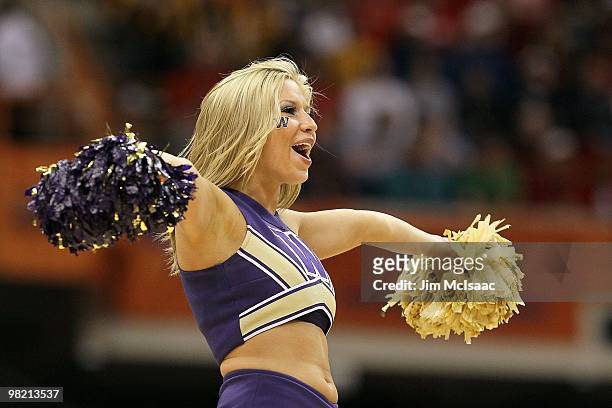 Cheerleader from the Washington Huskies performs against the West Virginia Mountaineers during the east regional semifinal of the 2010 NCAA men's...