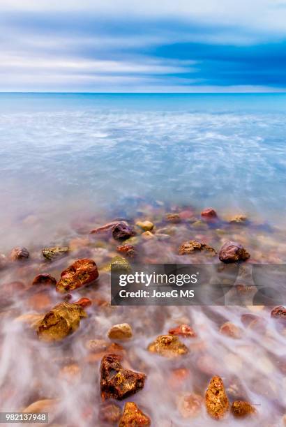 beach rocks (iii) - costa dorada stock pictures, royalty-free photos & images