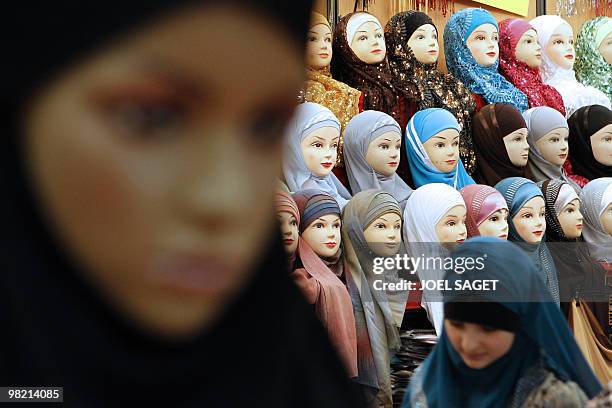 Veils are displayed on a women fashion stall of the annual meeting of French Muslims organized by the Union of Islamic Organisations of France in Le...