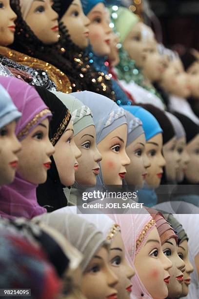 Veils are displayed on a women fashion stall of the annual meeting of French Muslims organized by the Union of Islamic Organisations of France in Le...