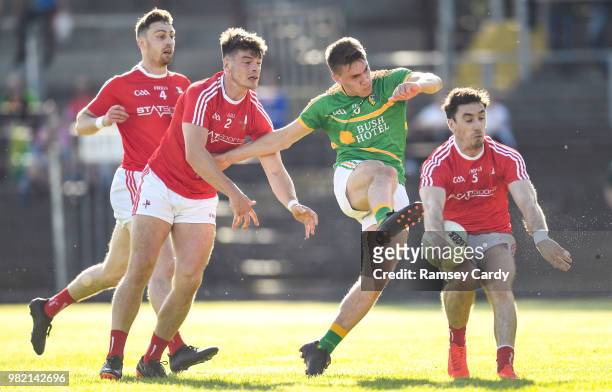 Carrick-on-Shannon , Ireland - 23 June 2018; Darragh Rooney of Leitrim haas a shot blocked by Darren Marks, left, and Derek Maguire of Louth during...
