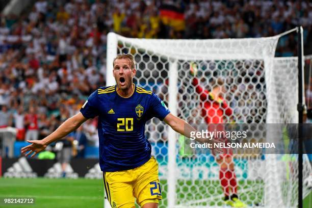 Sweden's forward Ola Toivonen celebrates scoring the opening goal during the Russia 2018 World Cup Group F football match between Germany and Sweden...