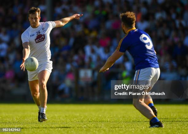 Longford , Ireland - 23 June 2018; Paddy Brophy of Kildare shoots as Conor Berry of Longford looks on during the GAA Football All-Ireland Senior...