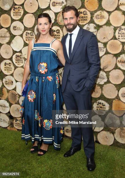 Jamie Dornan and Amelia Warner attend the Horan And Rose Charity Event held at The Grove on June 23, 2018 in Watford, England.