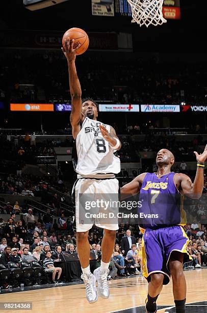 Roger Mason of the San Antonio Spurs takes the ball to the basket against Lamar Odom of the Los Angeles Lakers during the game on March 24, 2010 at...