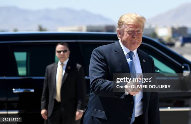 President Donald Trump arrives aboard Air Force One at McCarran International Airport in Las Vegas, Nevada, on June 23, 2018. - Trump will be...