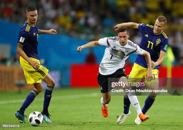 Julian Draxler of Germany challenge for the ball with Mikael Lustig and Viktor Claesson of Sweden during the 2018 FIFA World Cup Russia group F match...