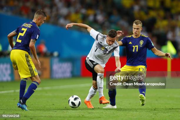 Julian Draxler of Germany challenge for the ball with Mikael Lustig and Viktor Claesson of Sweden during the 2018 FIFA World Cup Russia group F match...