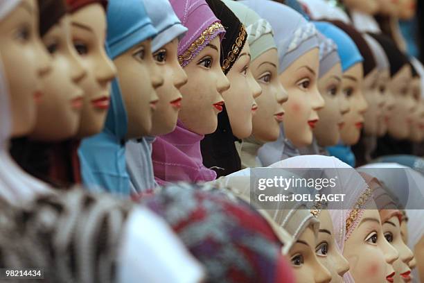 Veils are displayed on a women fashion stall of the annual meeting of French Muslims organized by the Union of Islamic Organisations of France in Le...