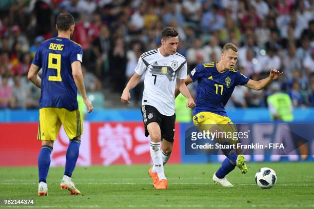 Julian Draxler of Germany challenge for the ball with Viktor Claesson of Sweden during the 2018 FIFA World Cup Russia group F match between Germany...