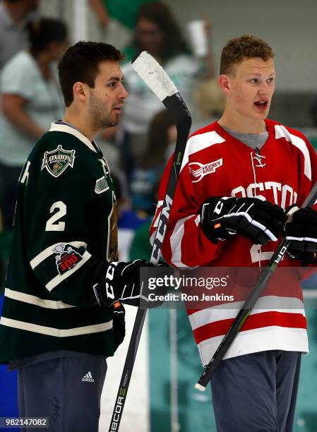 Evan Bouchard of Canada, left, and Brady Tkachuk of the USA participate in the Top Prospects Youth Hockey Clinic ahead of the 2018 NHL Draft at the...