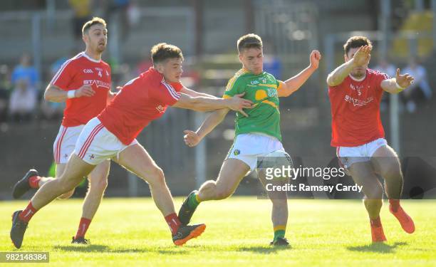 Carrick-on-Shannon , Ireland - 23 June 2018; Darragh Rooney of Leitrim has a shot blocked by Darren Marks, left, and Derek Maguire of Louth during...