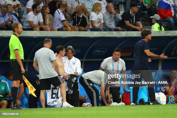 Sebastian Rudy of Germany receives treatment as Joachim Low head coach / manager of Germany reacts during the 2018 FIFA World Cup Russia group F...