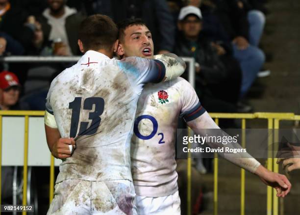 Jonny May of England celebrates with team mate Henry Slade after scoring a try during the third test match between South Africa and England at...