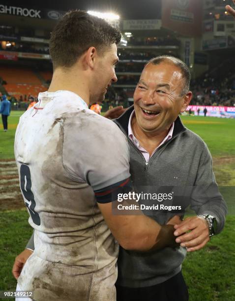 Eddie Jones, the England head coach celebrates wtih Ben Youngs after their victory during the third test match between South Africa and England at...