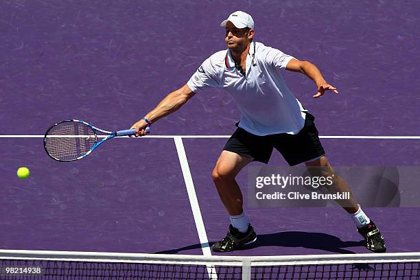 Andy Roddick of the United States returns a shot against Rafael Nadal of Spain during day eleven of the 2010 Sony Ericsson Open at Crandon Park...