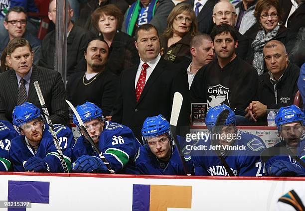 Head coach Alain Vigneault of the Vancouver Canucks looks on from the bench during the game against the San Jose Sharks at General Motors Place on...