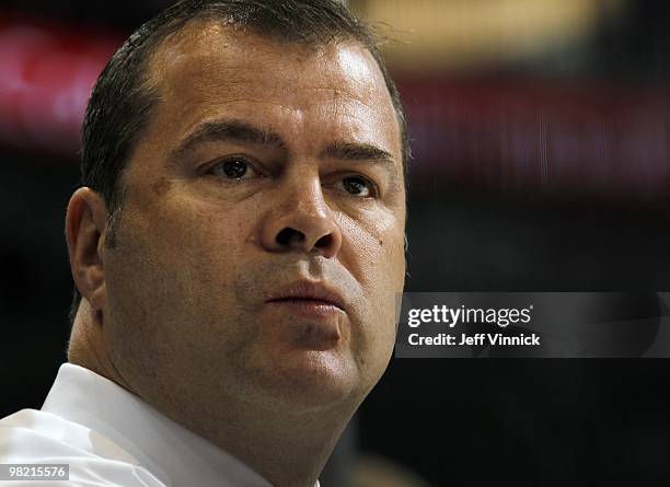 Head coach Alain Vigneault of the Vancouver Canucks looks on from the bench during the game against the San Jose Sharks at General Motors Place on...