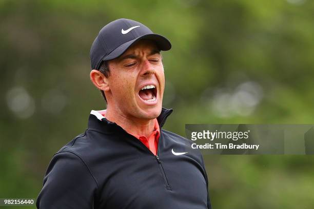 Rory McIlroy of Northern Ireland reacts to his shot from the fifth tee during the third round of the Travelers Championship at TPC River Highlands on...