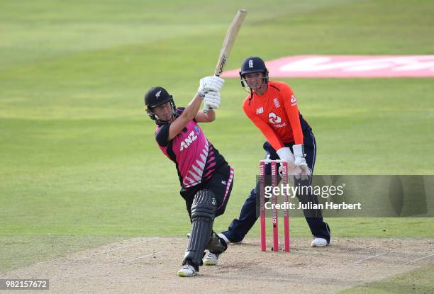 Sarah Taylor of England looks on as Sophie Devine of New Zealand scores runs during the International T20 Tri-Series match between England Women and...