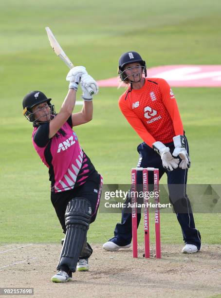 Sarah Taylor of England looks on as Sophie Devine of New Zealand scores runs during the International T20 Tri-Series match between England Women and...