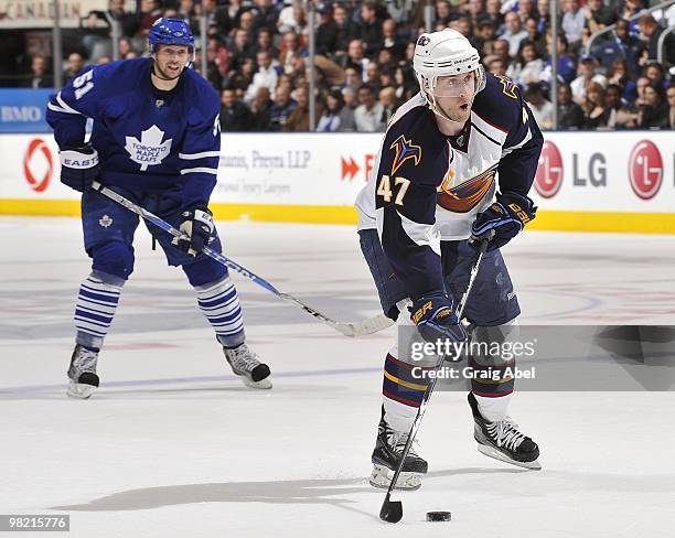 Rickard Wallin of the Toronto Maple Leafs skates after Rich Peverley of the Atlanta Thrashers during the game on March 30, 2010 at the Air Canada...