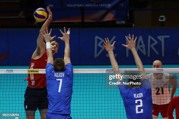 Mitchell Stahl attacks Dmitry Volkov and Ilia Vlasov during the FIVB Volleyball Nations League 2018 between USA and Russia at Palasport Panini on...