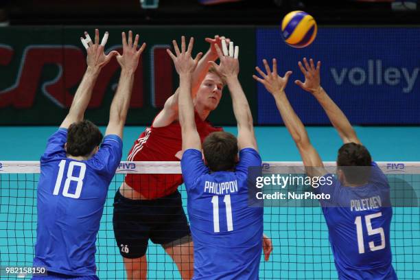 Kyle Ensing stopped by Egor Kliuka, Igor Philippov and Victor Poletaev during the FIVB Volleyball Nations League 2018 between USA and Russia at...