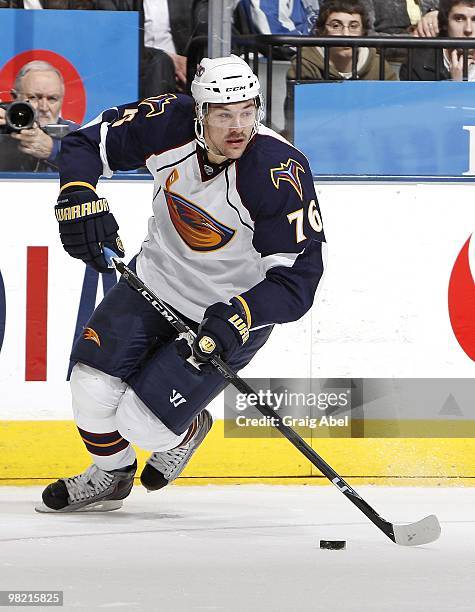 Evgeny Artyukhin of the Atlanta Thrashers skates with the puck during the game against the Toronto Maple Leafs on March 30, 2010 at the Air Canada...