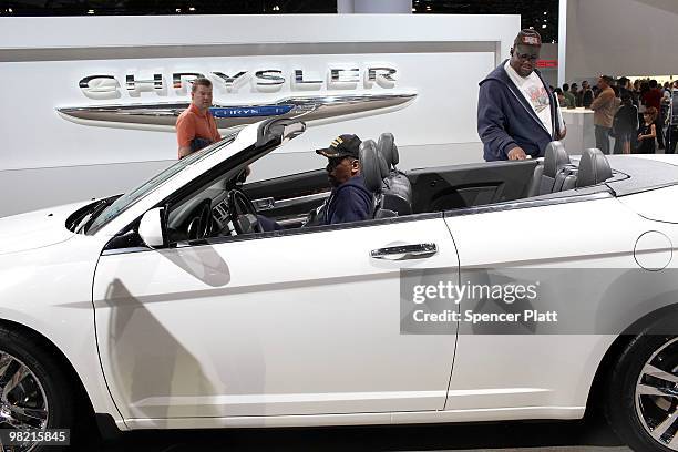 People look at a new Sebring convertible by Chrysler on the opening day of the New York International Auto Show on April 2, 2010 in New York City....