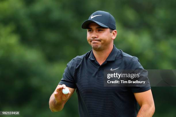 Jason Day of Australia acknowledges the gallery after making a par on the fourth green during the third round of the Travelers Championship at TPC...