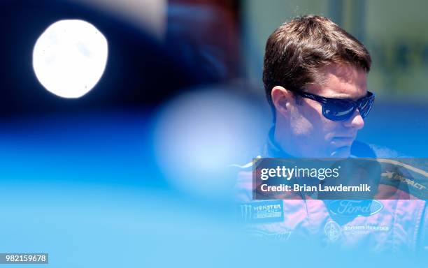 David Ragan, driver of the 1000Bulbs.com Ford, stands on the grid during qualifying for the Monster Energy NASCAR Cup Series Toyota/Save Mart 350 at...