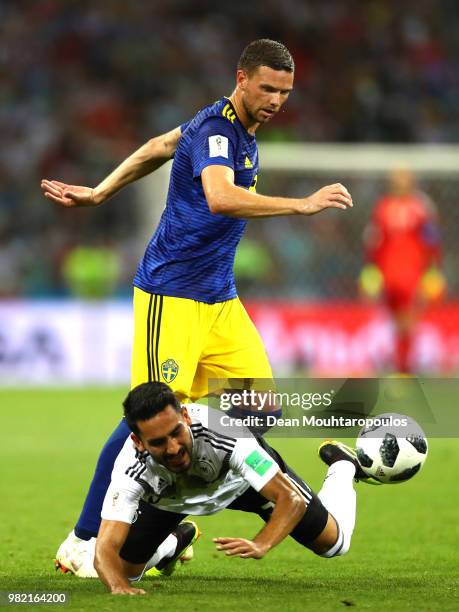 Ilkay Guendogan of Germany is tackled by Marcus Berg of Sweden during the 2018 FIFA World Cup Russia group F match between Germany and Sweden at...