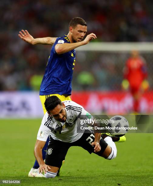 Ilkay Guendogan of Germany is tackled by Marcus Berg of Sweden during the 2018 FIFA World Cup Russia group F match between Germany and Sweden at...