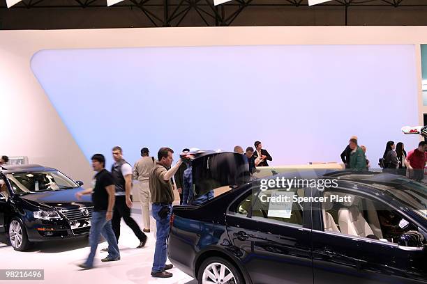 People look at new Volkswagon vehicles on the opening day of the New York International Auto Show on April 2, 2010 in New York City. The show, which...