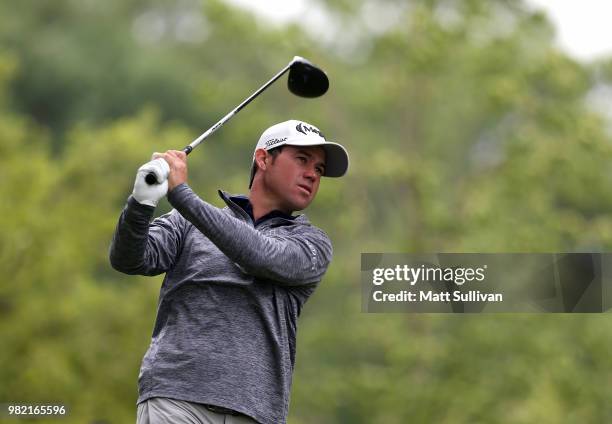 Brian Harman watches his tee shot on the fourth hole during the third round of the Travelers Championship at TPC River Highlands on June 23, 2018 in...