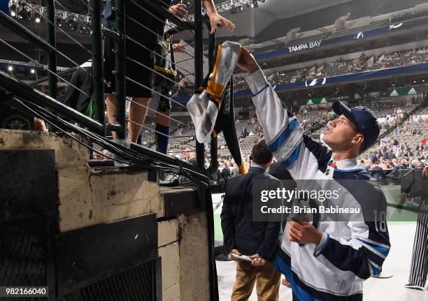 Declan Chisholm signs autographs after being selected 150th overall by the Winnipeg Jets during the 2018 NHL Draft at American Airlines Center on...