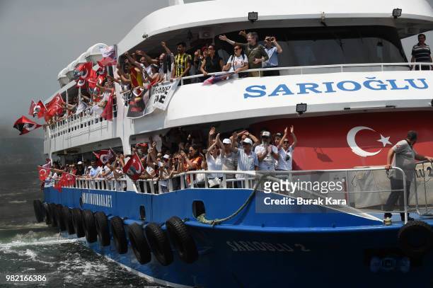 Supporters wave flags and cheer on ferries on their way to a rally for Muharrem Ince, presidential candidate of Turkey's main opposition Republican...