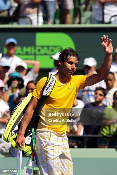 Rafael Nadal of Spain waves to the crowd after losing against Andy Roddick of the United States during day eleven of the 2010 Sony Ericsson Open at...