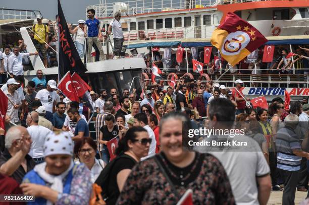 Supporters wave flags and cheer on ferries on their way to a rally for Muharrem Ince, presidential candidate of Turkey's main opposition Republican...