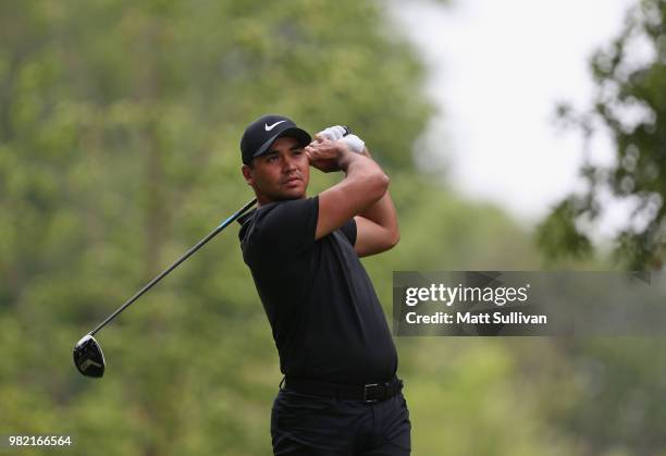 Jason Day of Australia watches his tee shot on the fourth hole during the third round of the Travelers Championship at TPC River Highlands on June...