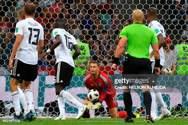 Germany's goalkeeper Manuel Neuer saves the ball during the Russia 2018 World Cup Group F football match between Germany and Sweden at the Fisht...