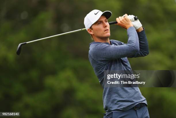 Russell Henley of the United States plays his shot from the fifth tee during the third round of the Travelers Championship at TPC River Highlands on...